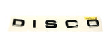 Genuine Land Rover Discovery 5 Front "DISCO" Name Plate In Black - LR082802